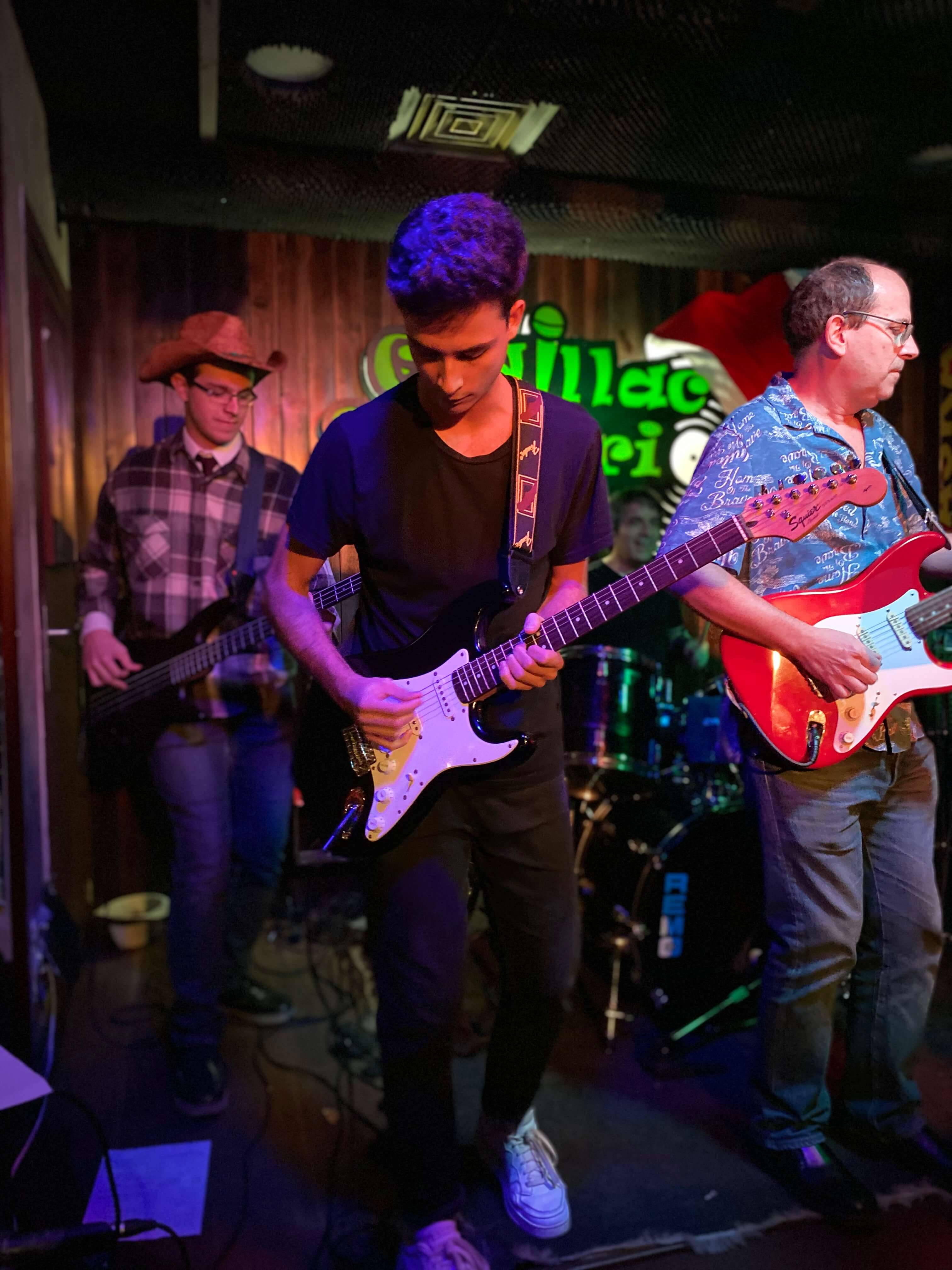 Three people playing instruments